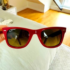 Red Ray Ban wayfarer sunglasses with madras pattern on inside.